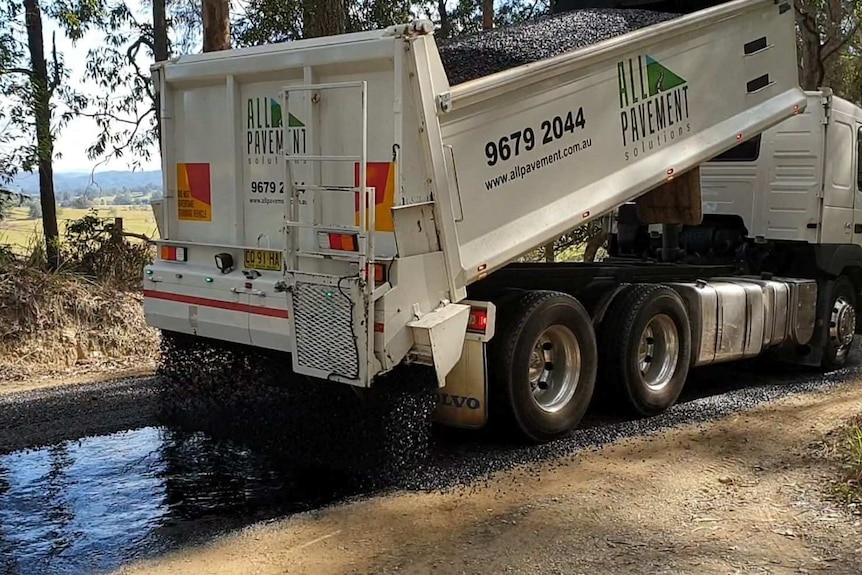 Roadworks at Macksville to lay an Otta seal recycled road base