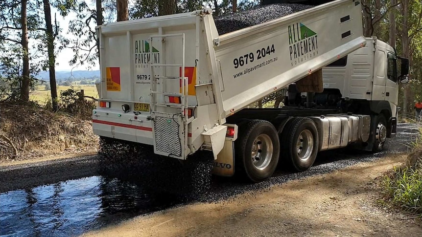 Roadworks at Macksville to lay an Otta-Seal recycled road base
