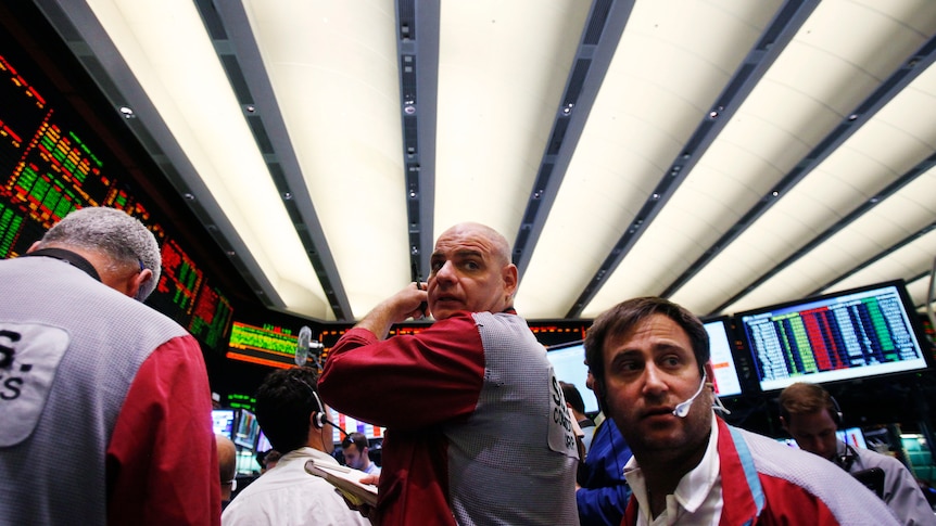 Wall Street traders in red and blue uniforms.