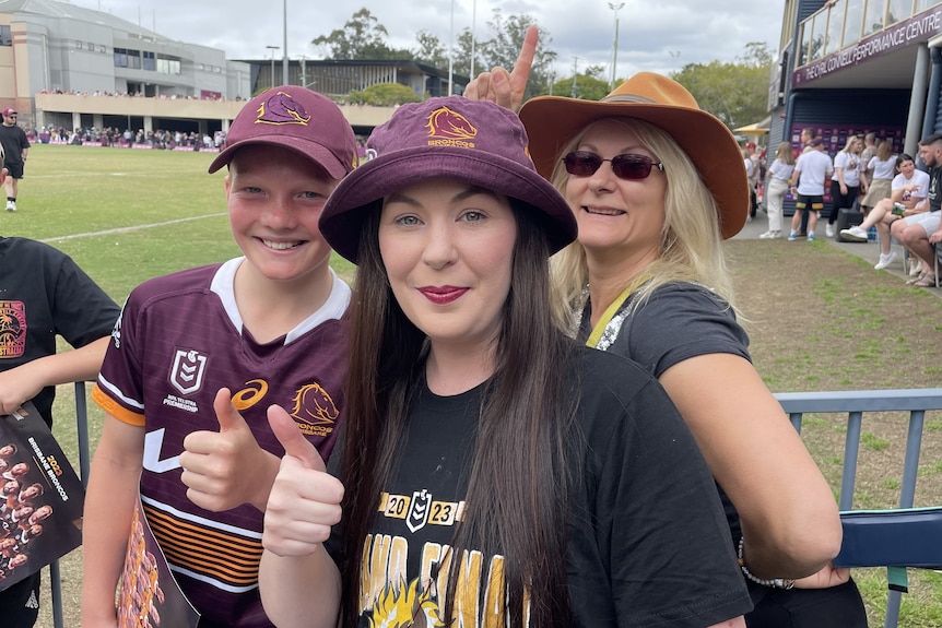 Broncos supporters wear maroon merchandise