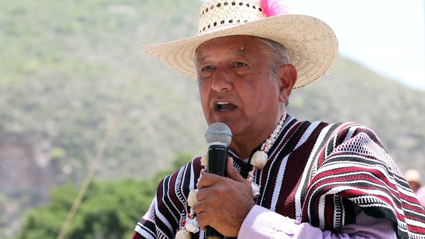AMLO in a hat and poncho