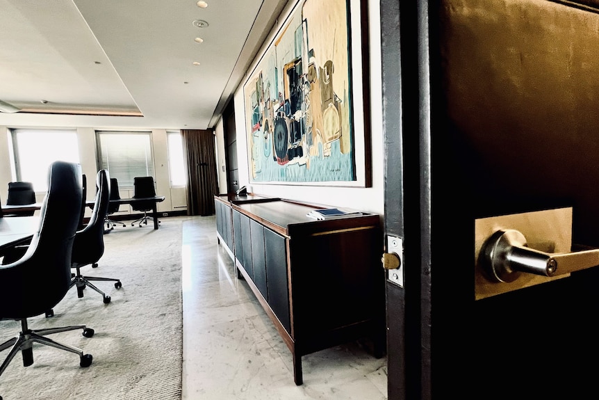 The door to the RBA boardroom stands open, with board table and painting in view.
