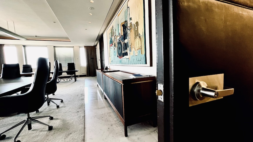 The door to the RBA boardroom stands open, with board table and painting in view.