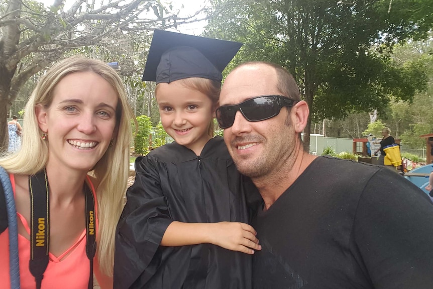 Ashley Sargeson and her husband at their daughter Lily's preschool graduation.