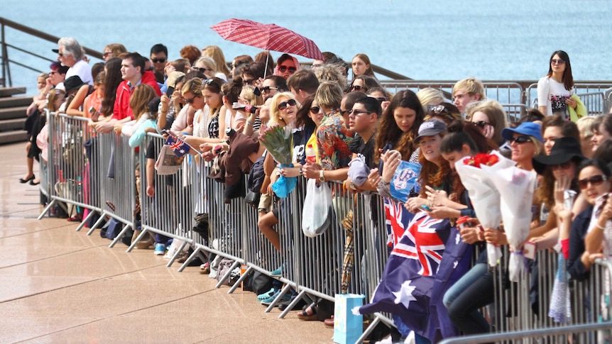 People wait for the arrival of the Duke and Duchess of Cambridge at the Sydney Opera House.