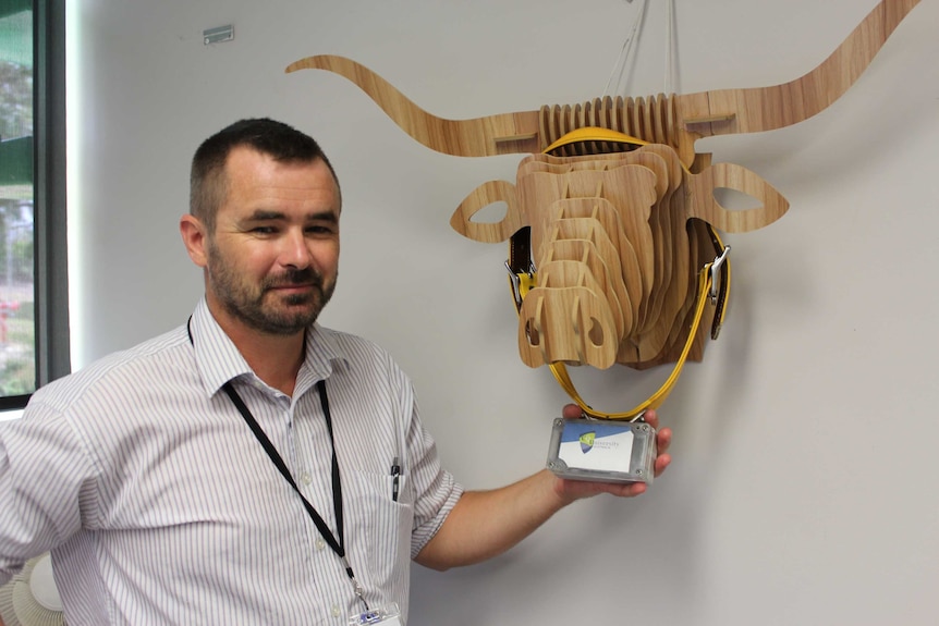 Researcher Mark Trotter with one of the livestock GPS sensors