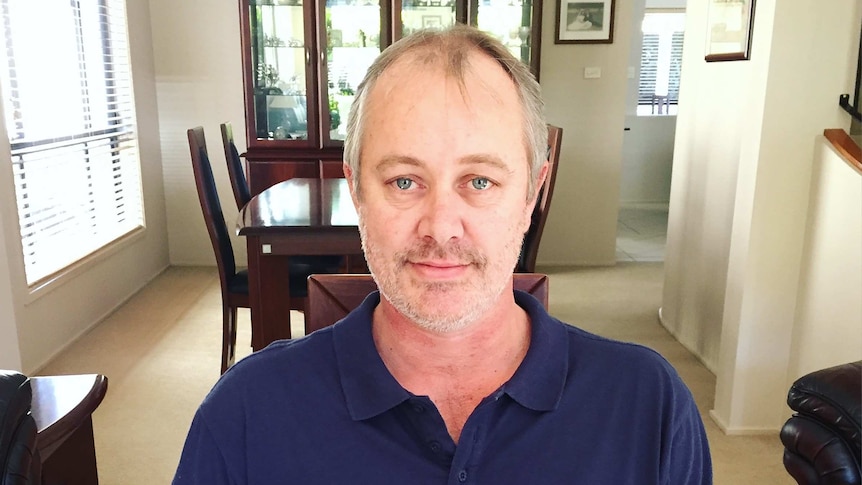 Leukaemia patient, Scott Kidd, in the lounge room of his home. July 2017