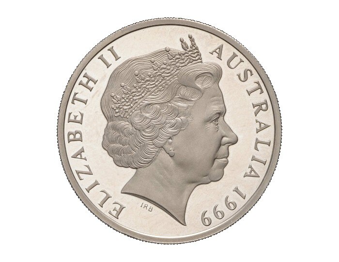 An Australian silver coin from 1999 with an effigy of Queen Elizabeth II as an old woman wearing a crown.