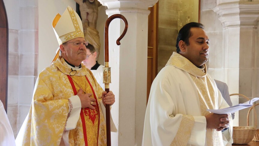 Archbishop Julian Porteous enters St Mary's Cathedral in Hobart