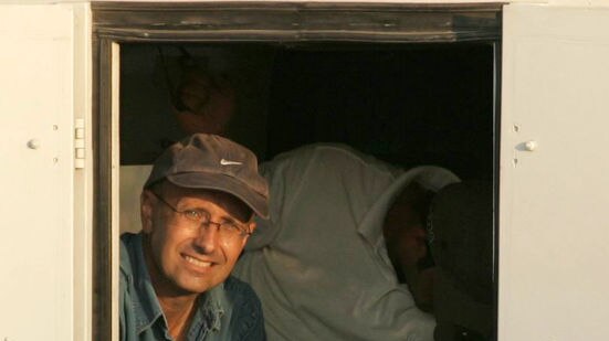 BBC Gaza correspondent Alan Johnston sits inside an armoured car