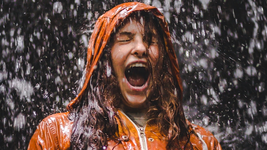Girl screams while being drenched in rain