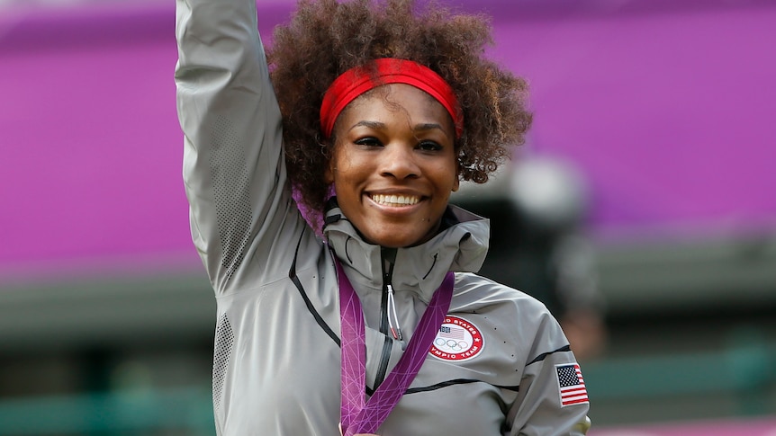 Serena Williams holds her gold medal