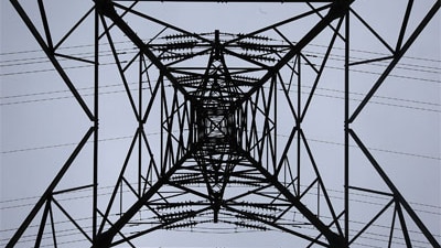 An electricity pylon carries power from a nuclear power station in the UK