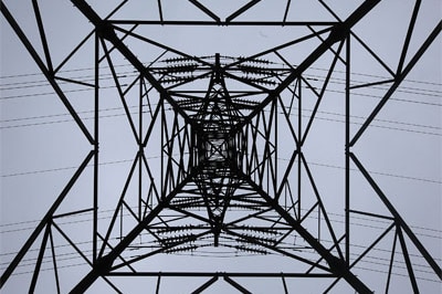 An electric pylon carries power from a nuclear power plant in the UK