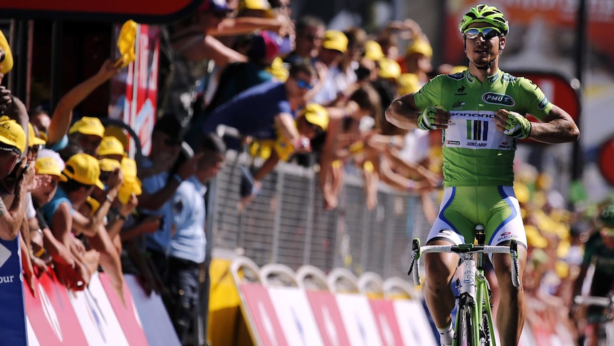 Peter Sagan celebrates as he crosses the line in the Tour de France