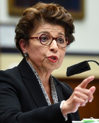 Jovita Carranza speaking in a microphone