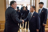 US Secretary of State Mike Pompeo shakes hands with Kim Yong Chol.
