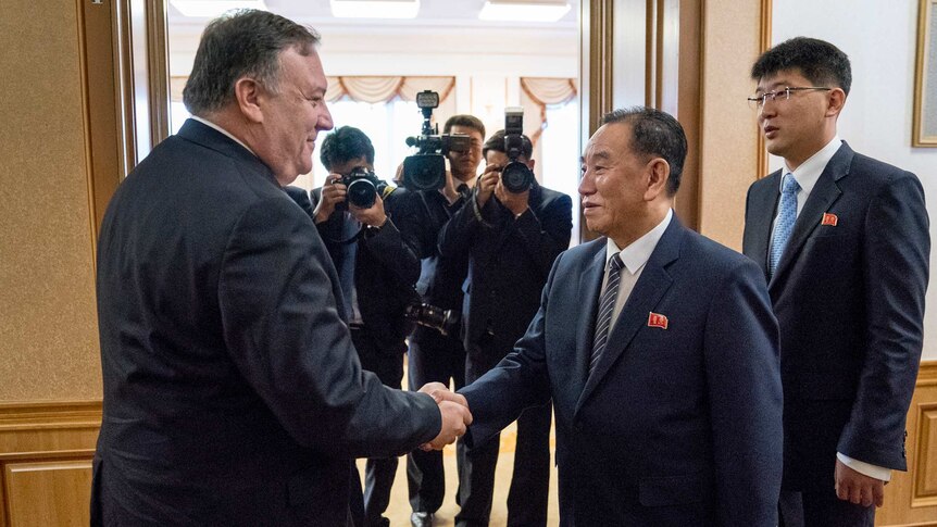 US Secretary of State Mike Pompeo shakes hands with Kim Yong Chol.