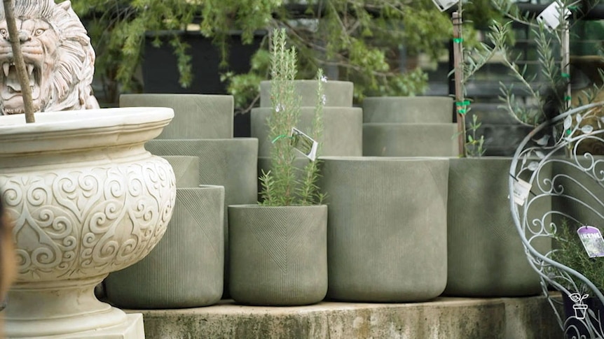 A slection of concrete pots in a nursery.