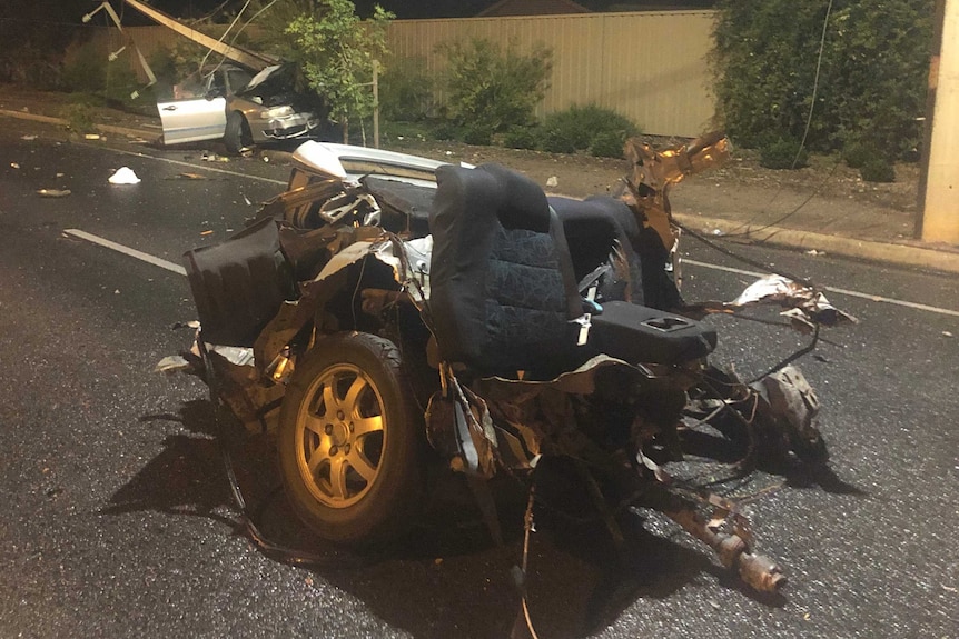 A car split in two on a road