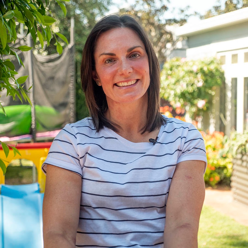 Christie Dawes smiling outdoors at home