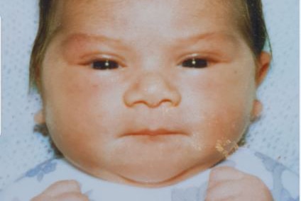 A tight head and shoulders shot of baby Adell Sherylee Partridge.