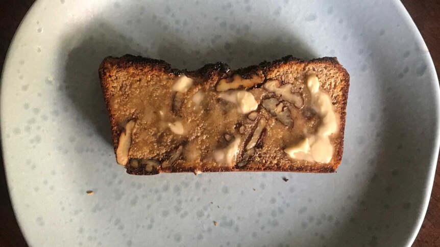 Joel's banana bread with butter on a plate