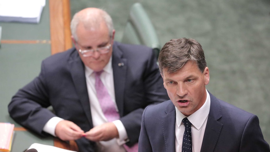 Angus Taylor speaks at the despatch box with Scott Morrison listening in