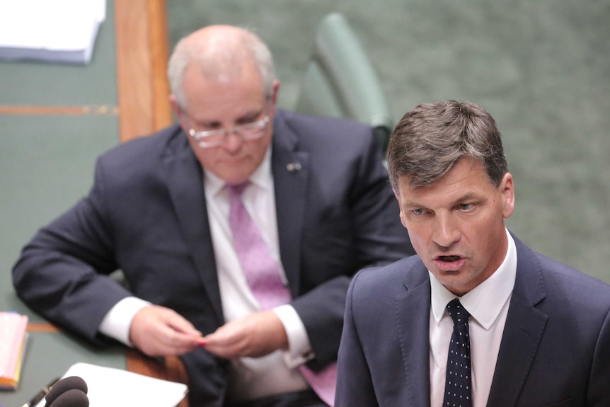 Angus Taylor speaks at the despatch box with Scott Morrison listening in