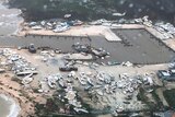 Boats litter the area around marina in the Bahamas after they were tossed around by Hurricane Dorian.