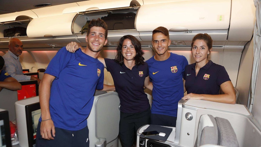 FC Barcelona players joined together for a quick photo in business class section.