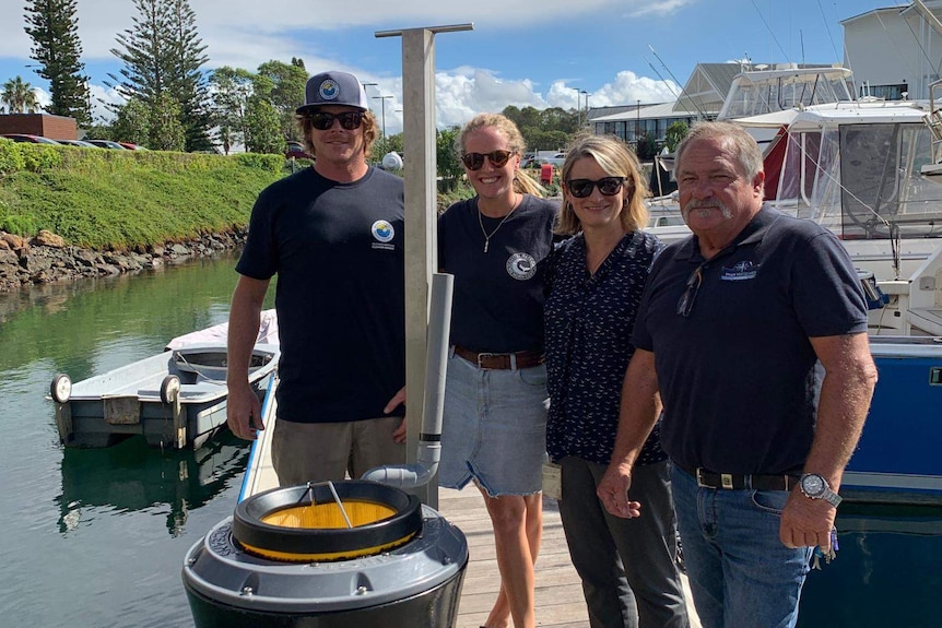 Seabin project chief Pete Ceglinski (left), Meegan Stephens, Nicky Julian and Alec Mulvey with one of two Seabins installed.