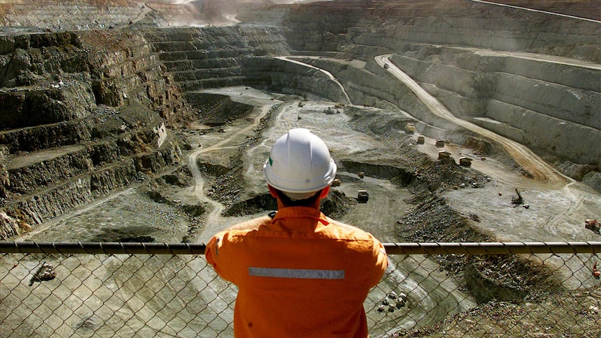 A miner looks across the largest open put gold mine in Australia in Kalgoorlie, Western Australia.