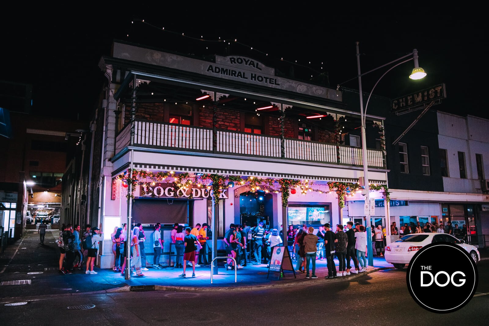 A crowd gathers out the front of a nightclub