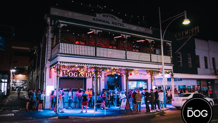 A crowd gathers out the front of a nightclub