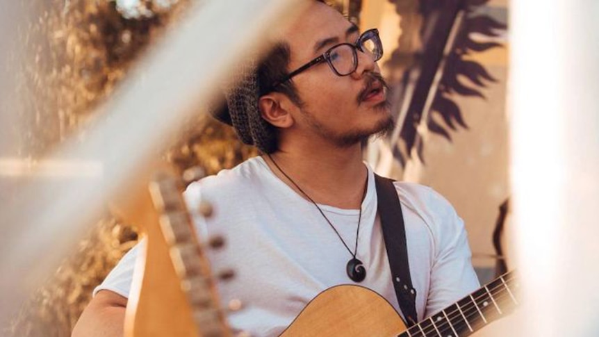 Image of Luke Liang playing guitar