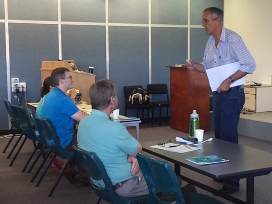 Australian author Tony Park speaks to military veterans in a creative writing class in Perth.