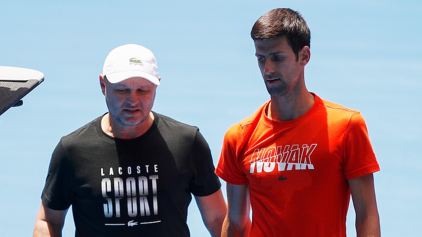 Novak Djokovic of Serbia (right) speaks with former coach Marian Vajda at 2019 Australian Open