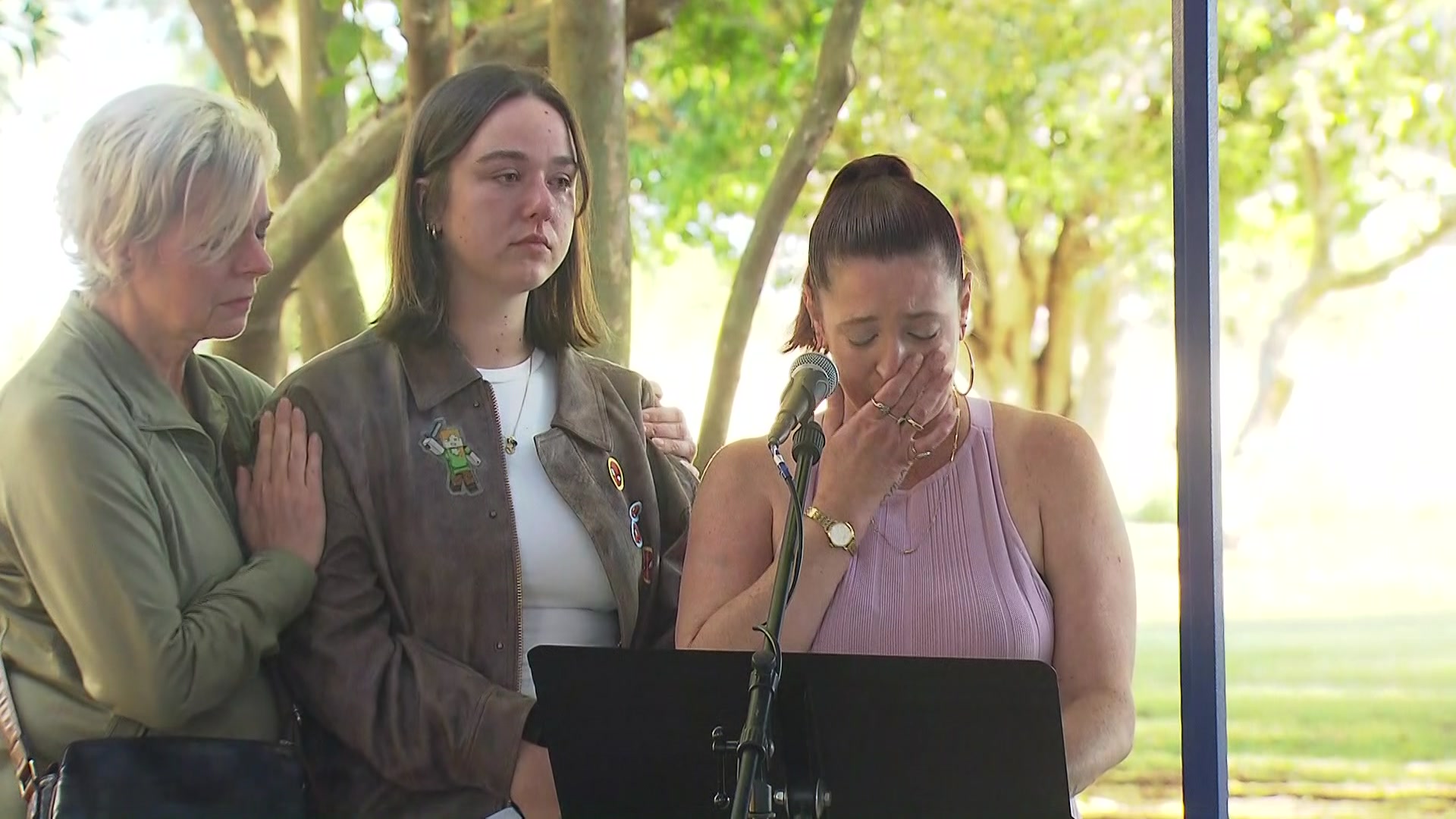 Alana Young addresses the crowd through tears on Russell Island