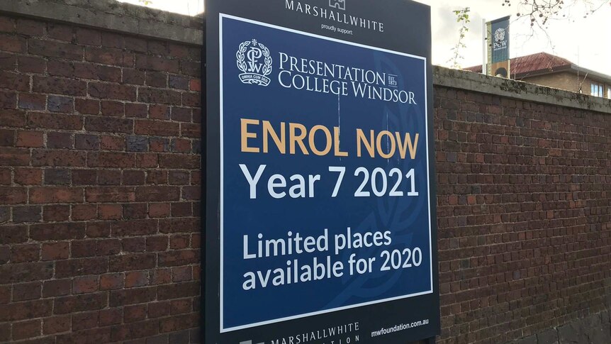 A sign outside Presentation College Windsor calls for Year 7 enrolments for 2021.