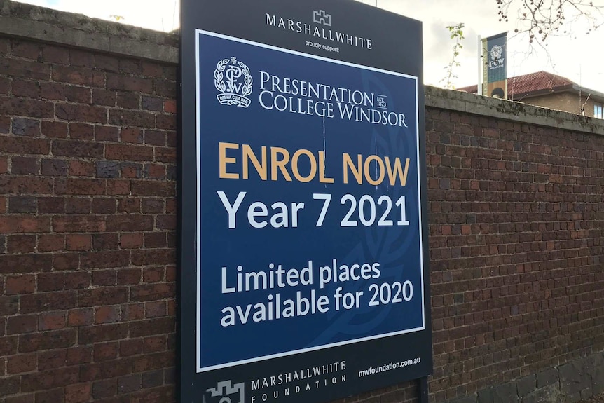 A sign outside Presentation College Windsor calls for Year 7 enrolments for 2021.