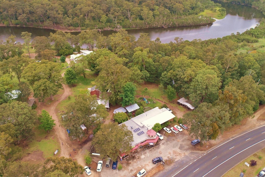 A small caravan park sits next to picturesque rivers and bushland