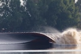 Kelly Slater riding an artificially made wave.