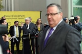 Liberal Member for Herbert Ewen Jones (right) interrupts Palmer United Party leader Clive Palmer