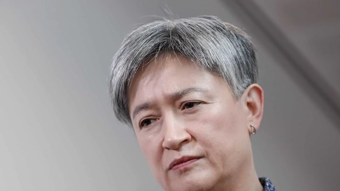 Labor Senator Penny Wong wears a stern facial expression