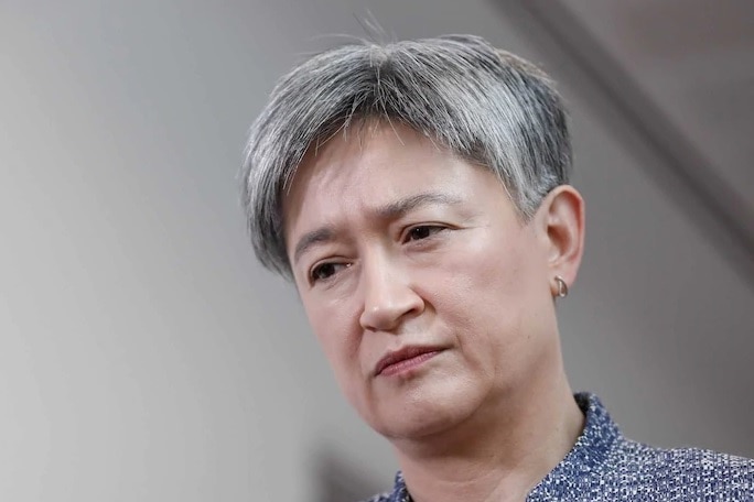 Labor Senator Penny Wong wears a stern facial expression