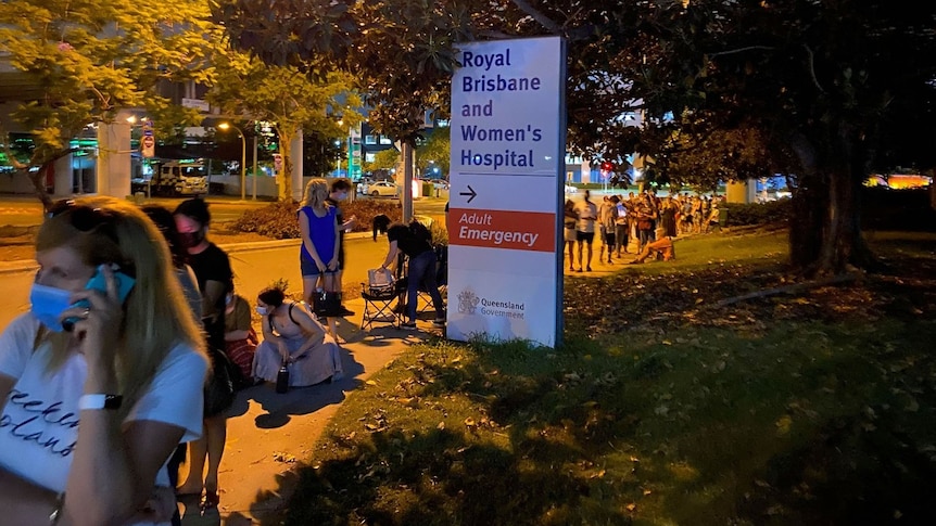 People queue to get tested for COVID-19 at Royal Brisbane and Women's Hospital.