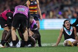 Two Port Adelaide Power AFL players receive attention from medical staff after a head clash.