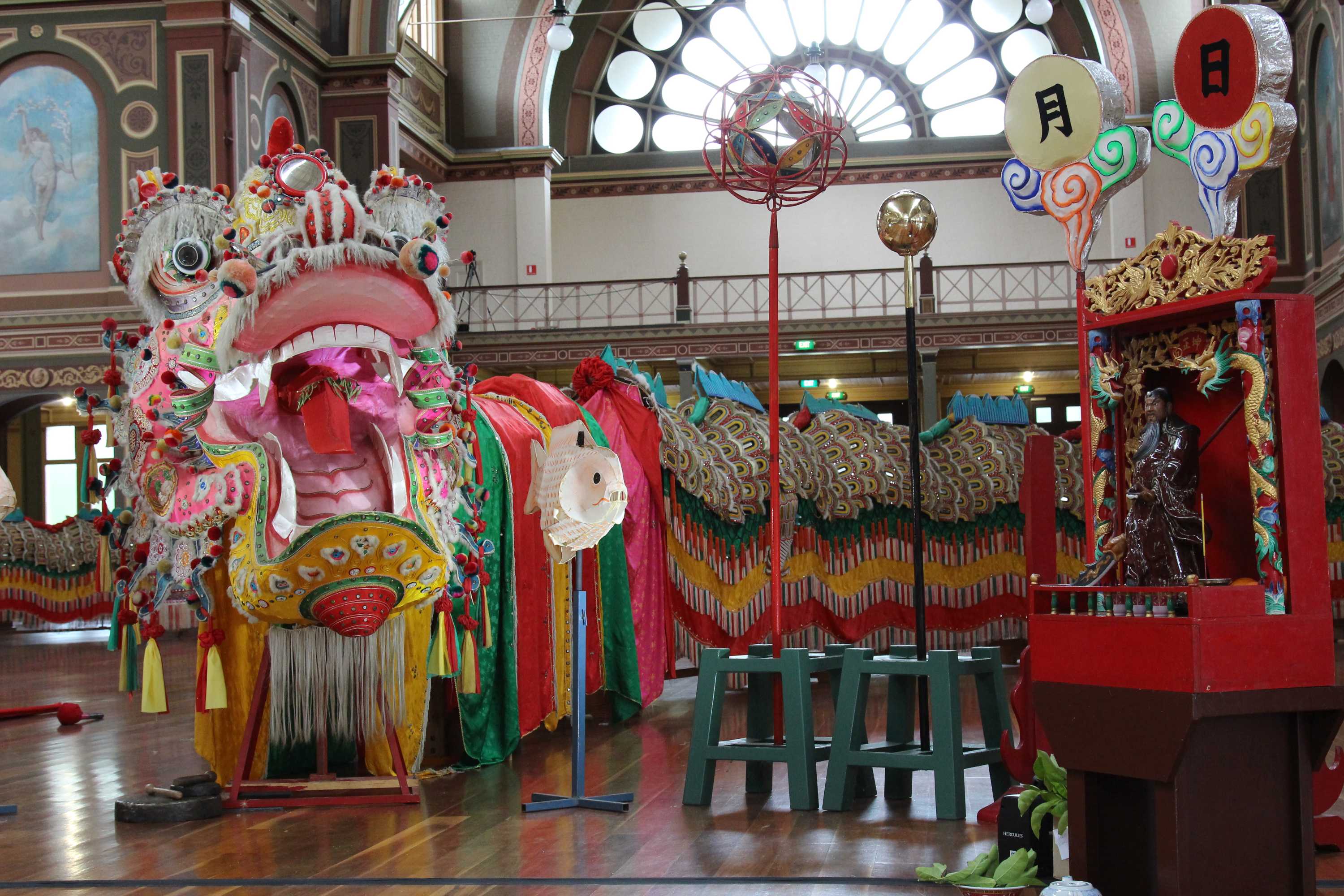 A photo of Sun Loong covered in silk scales and tiny mirrors.