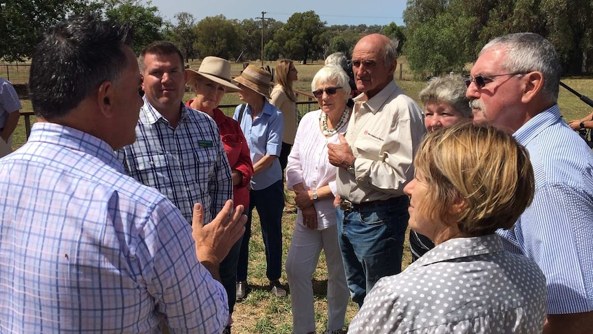 John Barilaro and Douglas Saunders talking to farmers